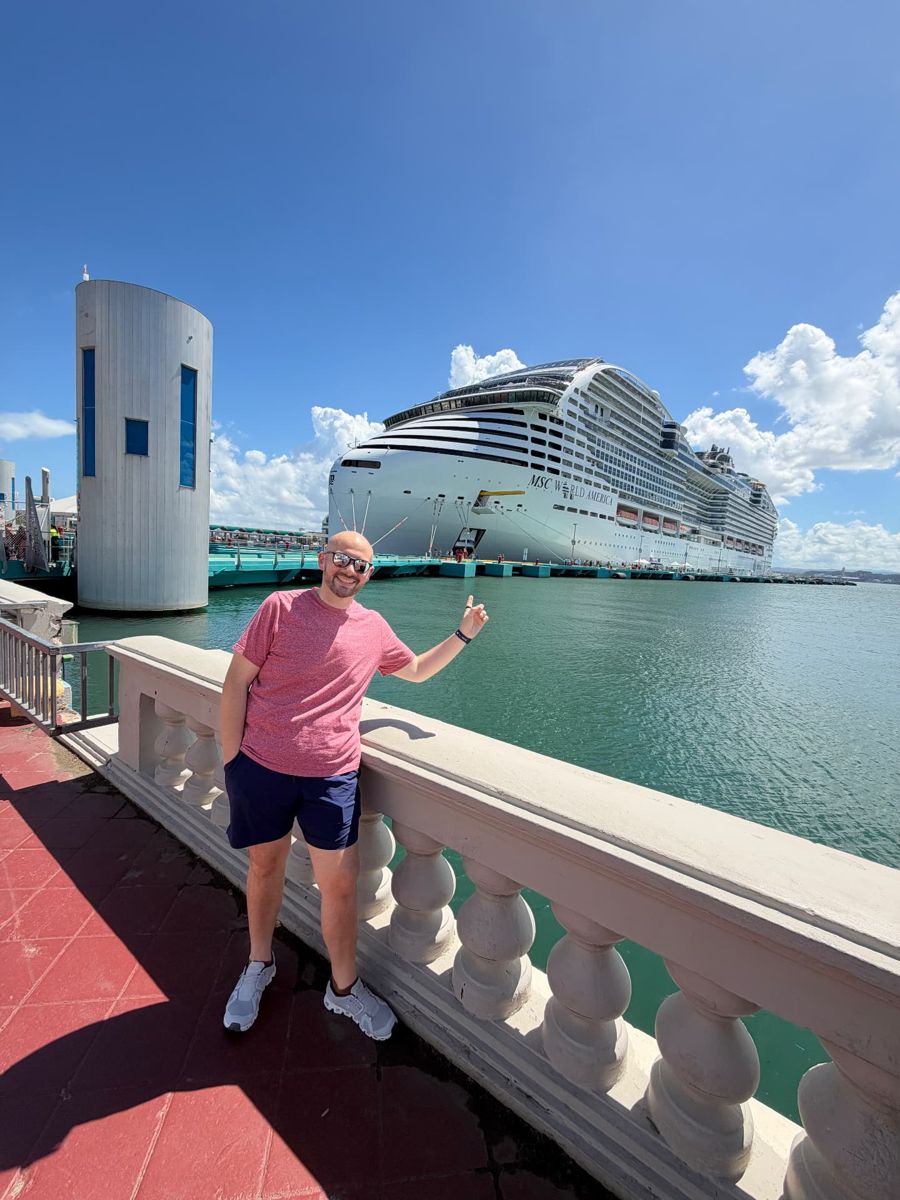 Chris with MSC World America docked behind him