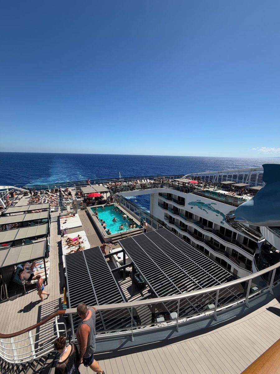 Pool decks and the ship's wake from high above the stern