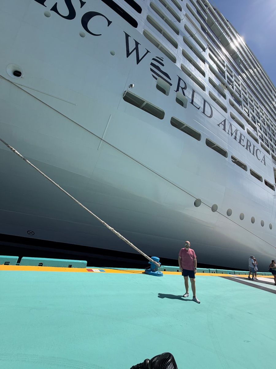 Chris at the pier beside MSC World America